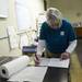 Director Carol Akerlof looks over a log of injured birds while at the Bird Center of Washtenaw County on Tuesday morning. Melanie Maxwell I AnnArbor.com